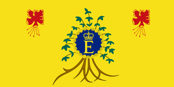 Former flag of Elizabeth II, Queen of Barbados. The background of the flag is bright yellow, and the queen's gold and blue personal symbol (a golden letter E with a crown above it, surrounded by a golden garland of flowers with a dark blue background) is featured at center, with the leaves and hanging roots of a bush extending out from behind it. At the upper left and upper right are two identical simplified drawings of a red tropical flower.